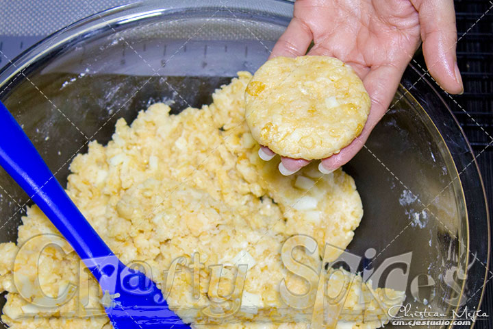 Cheesy Rice Krispies treats - flattening