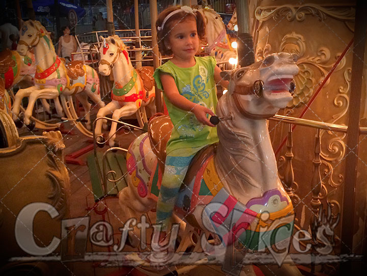 Kira having fun on carousel