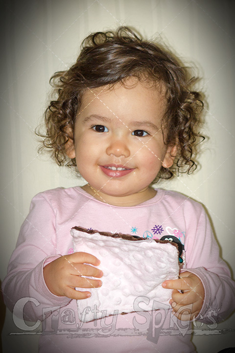 Kaylee Playing with her Bebe Bella Designs Crinkle Toy