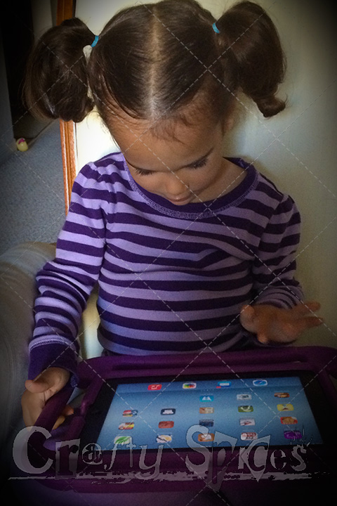 Kira having fun using the iPad with the Gripcase