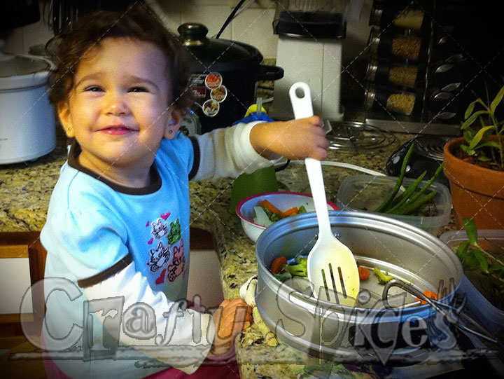 Kira at an early age helping in the kitchen