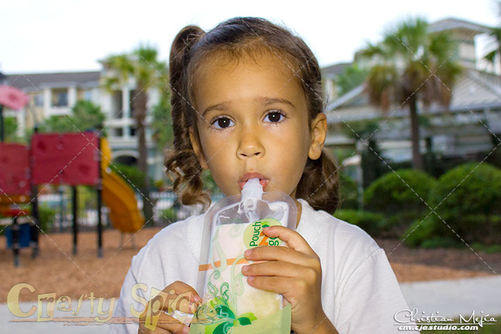 Kira enjoying a healthy treat in a Pouch2Go