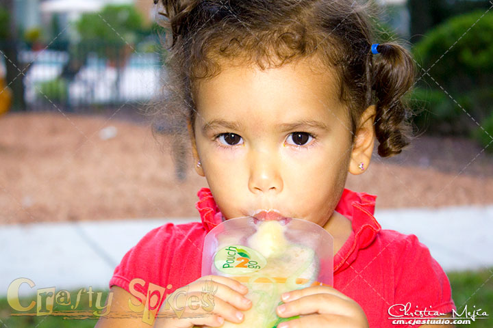 Kaylee enjoying a healthy treat in a Pouch2Go