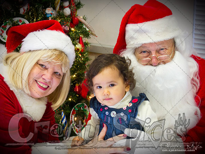 Kaylee with Santa and Mrs. Claus