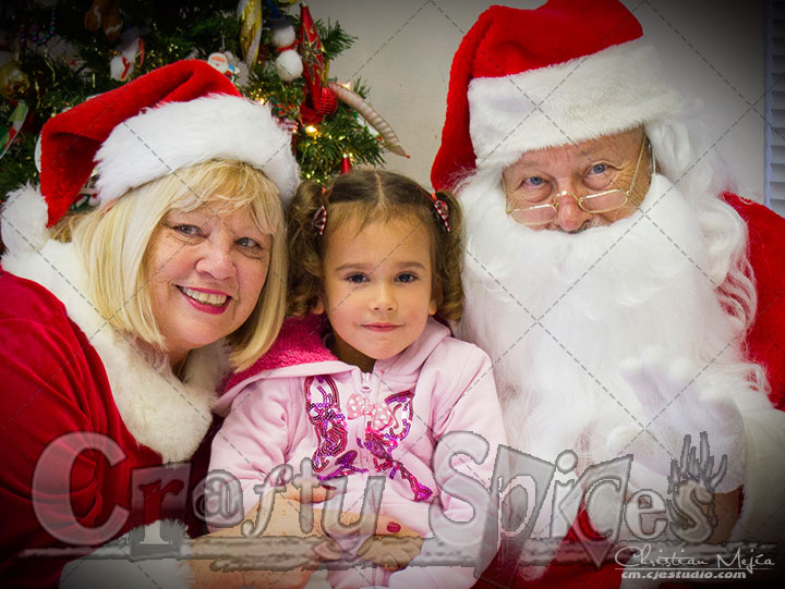 Kira with Santa and Mrs. Claus